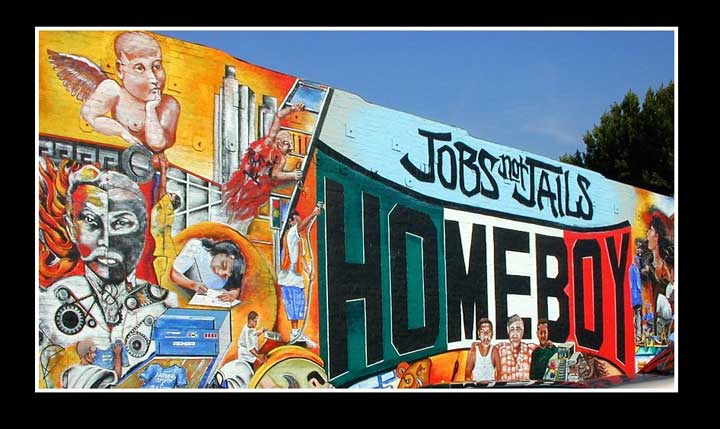 Mural outside the offices of Homeboy Industries in Boyle Heights.  The organization's slogan is "Jobs not Jails."  Courtesy of Homeboy IndustriesMural a fuera de las oficinas de Industrias Homeboy en Boyle Heights. El slogan de la organización es “Empleos no Cárceles.” Cortesía de Homeboy Industries.